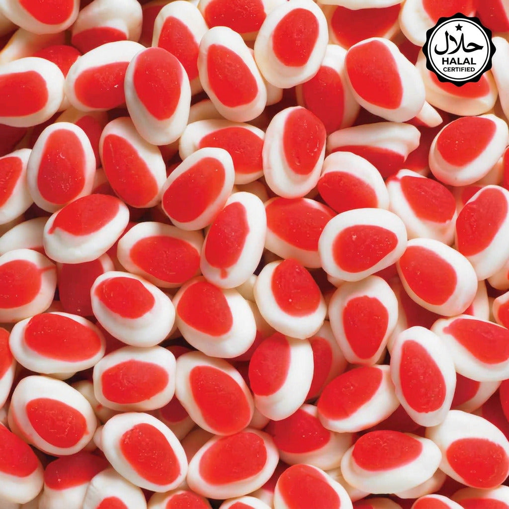 A close-up image of small, round candies with a red center and white surrounding edge, resembling strawberries and cream in a 250g package.