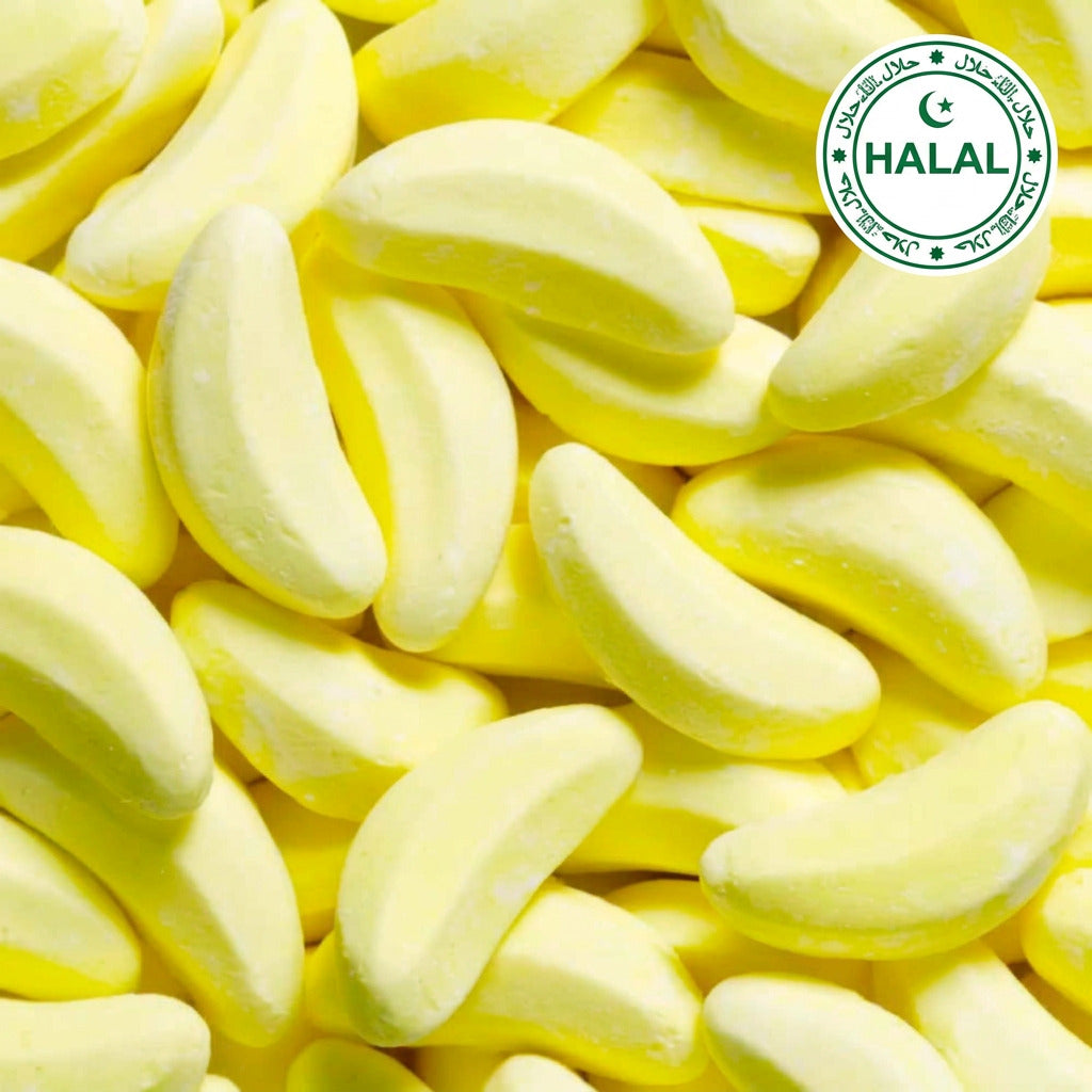 A close-up image of yellow banana-shaped candy lollies.