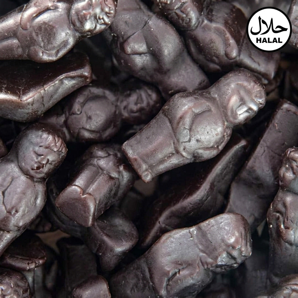A close-up of small chocolate candies shaped like babies, packed together.