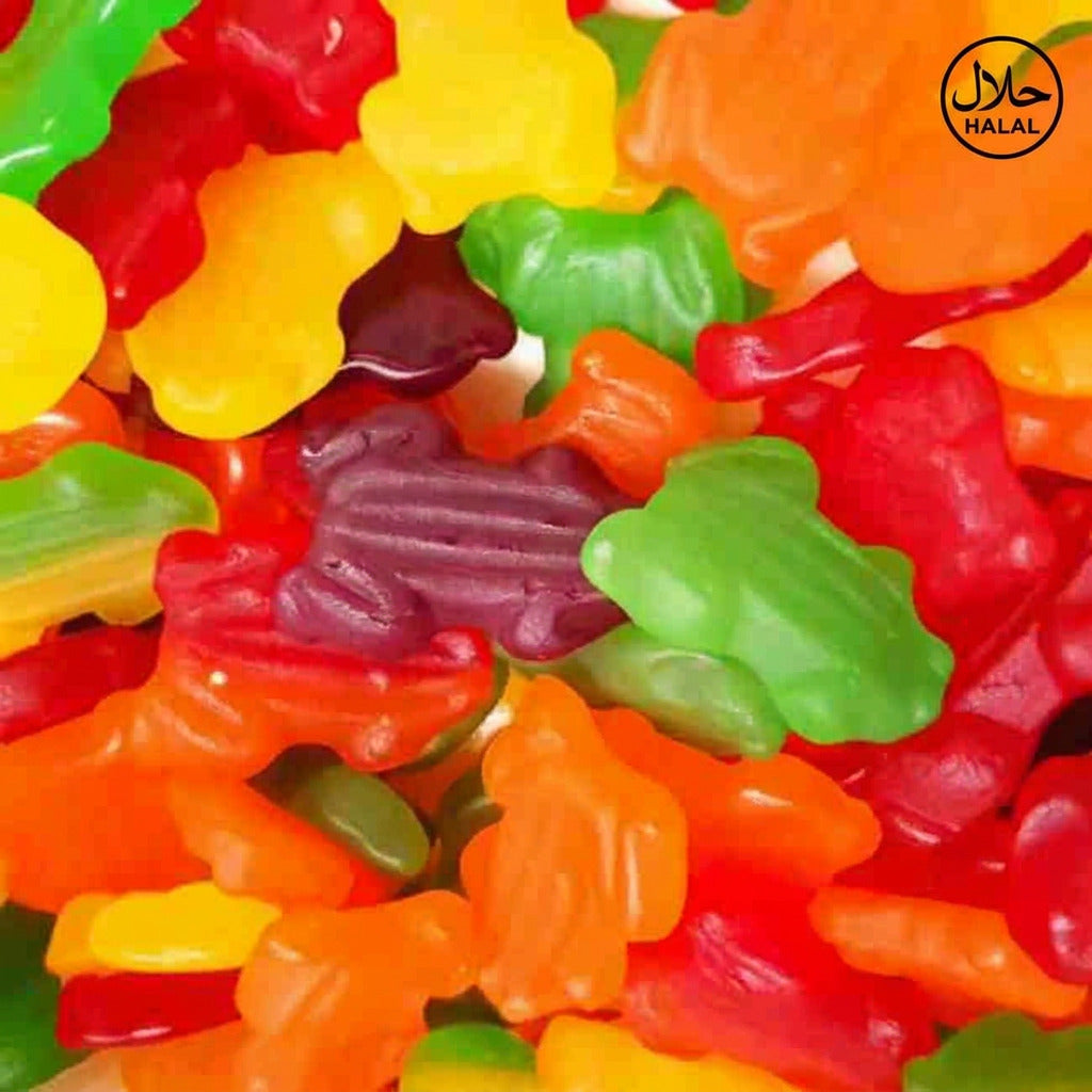 A close-up image of colorful gummy candies shaped like frogs.