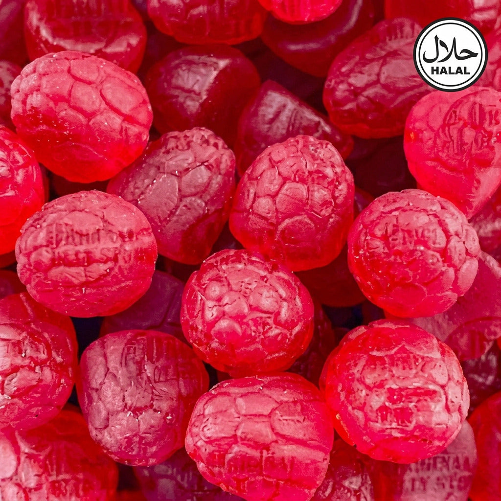 A close-up of a collection of red lollipops with a textured surface, likely made from glucose syrup, cane sugar, and gelatine.